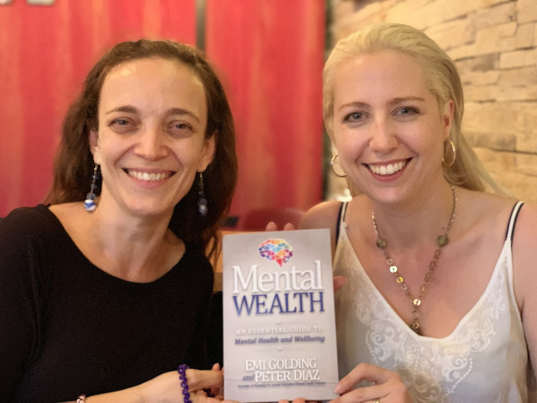 Begoña Gomez and Emi Golding with Mental Wealth book